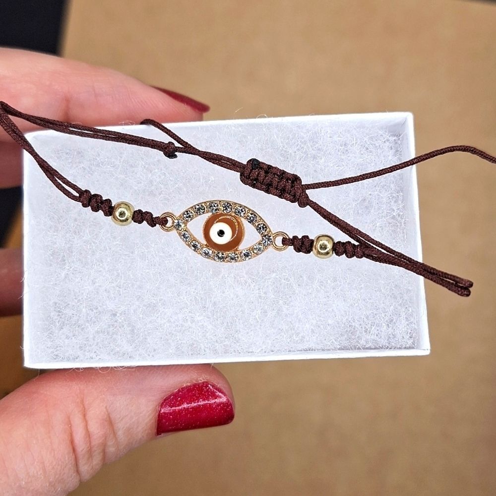 Brown adjustable evil eye string bracelet protection accessory